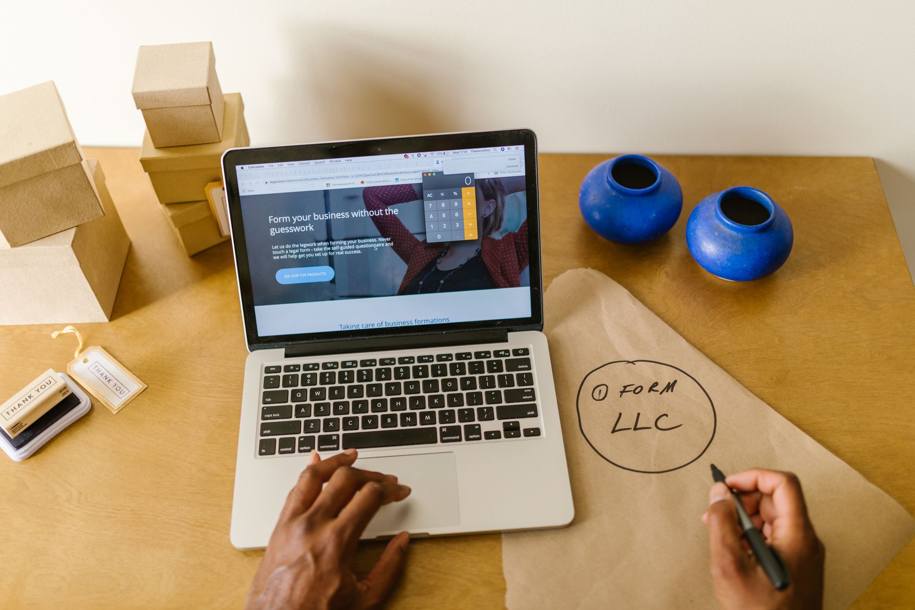 A small business owner reviewing their website and Google listing on a laptop